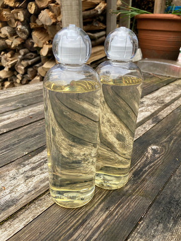 Two Unlabelled Bottles of Unicorn Power Scour
