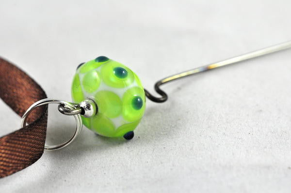 Spinner's Fetch Hook (Orifice hook) with Green/White Lampwork Bead